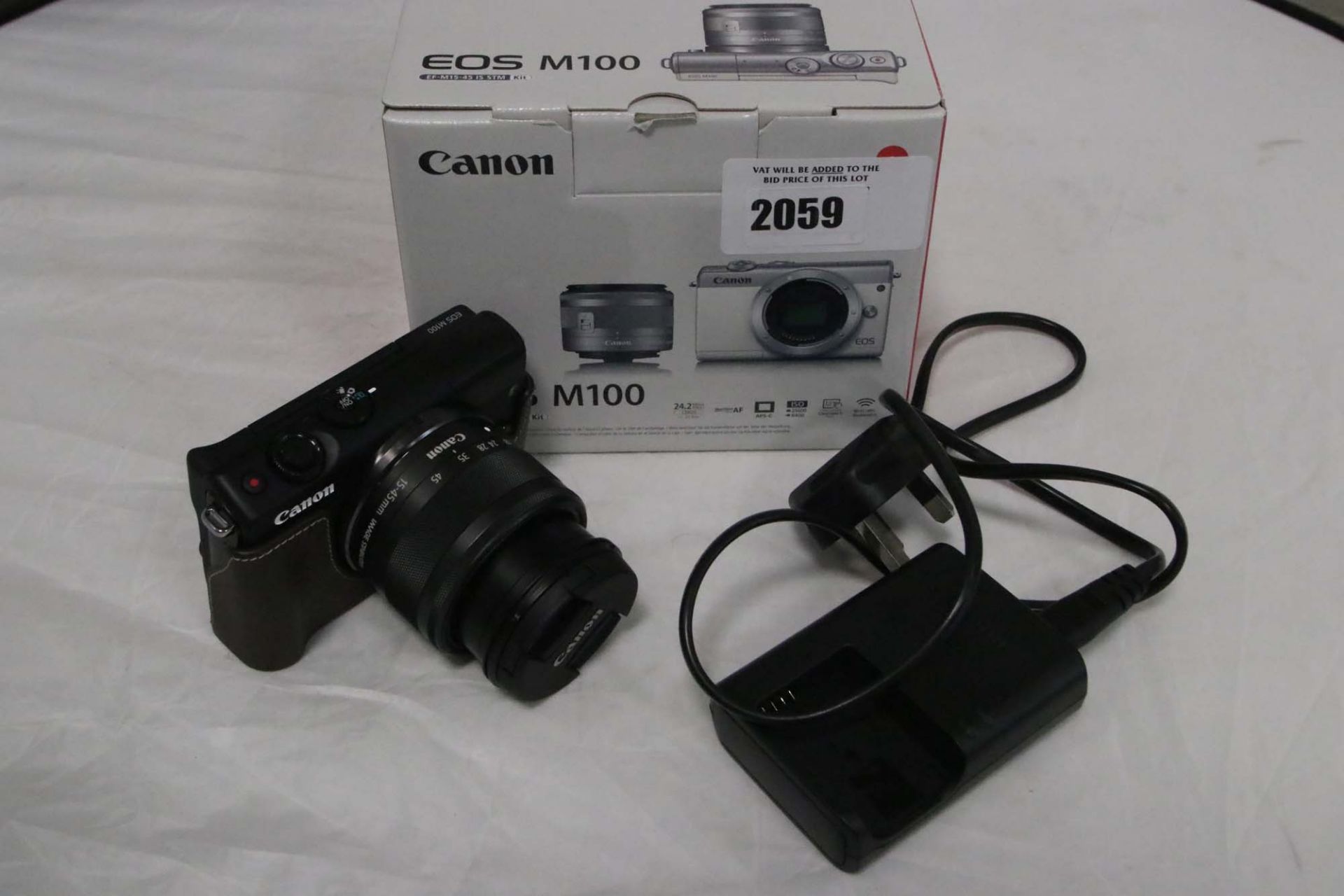 Canon EOS M100 camera with 15 - 45mm lens kit, charger and box