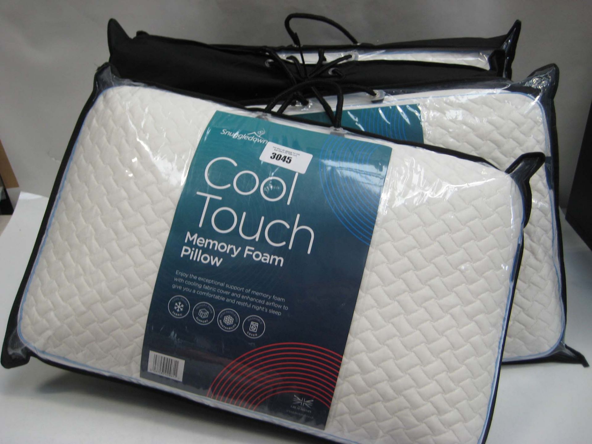 4 bagged Cooltouch memory foam pillows by Snuggledown