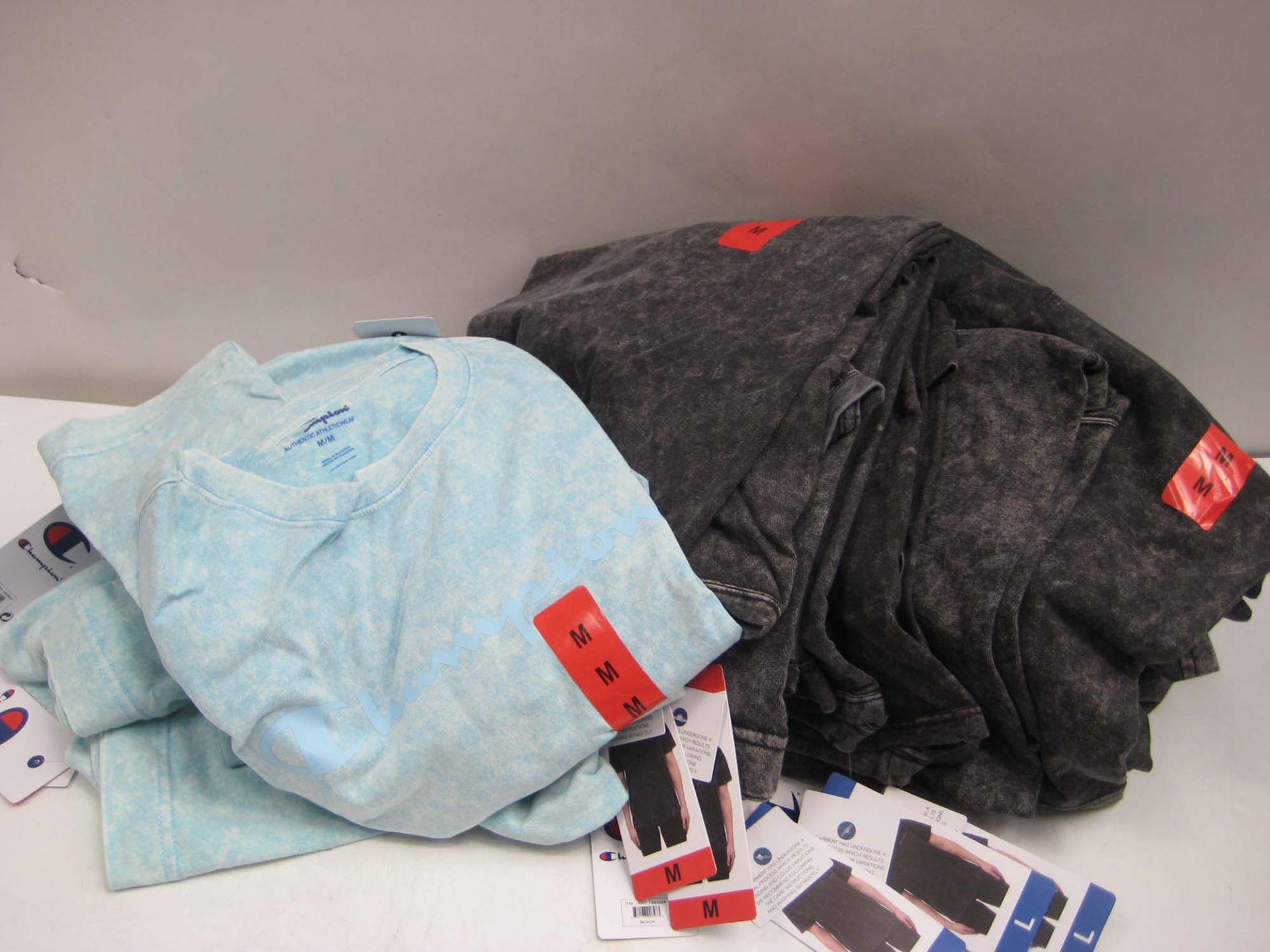 Bag containing ladies charcoal grey t-shirts by Champion sizes ranging from XXL to M (approx 20,