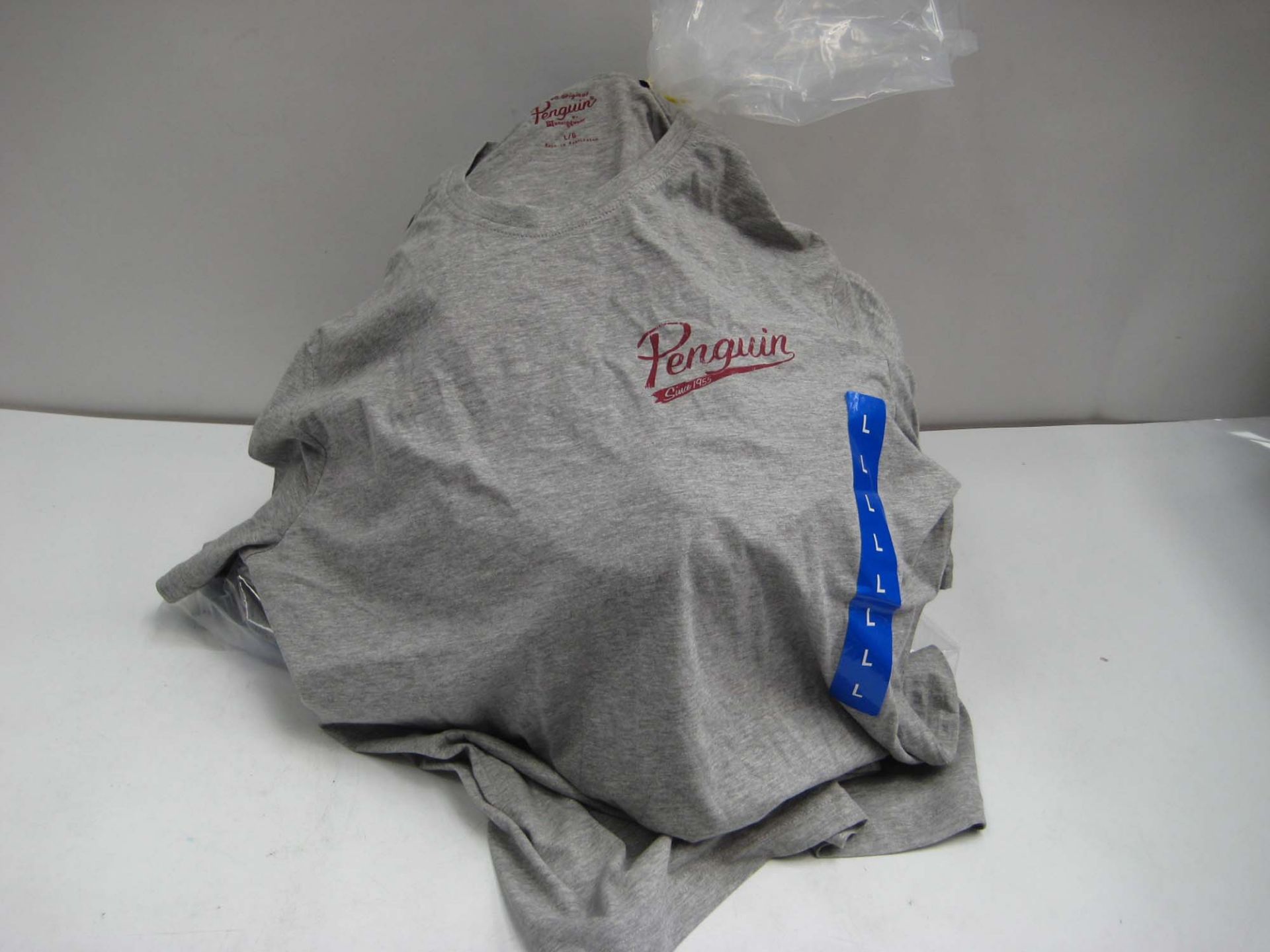 Bag containing approx 25 Penguin t-shirts in light grey