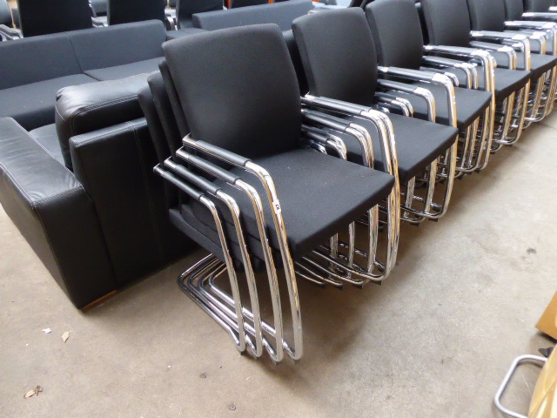 Stack of 4 black cloth and chrome framed cantilever chairs