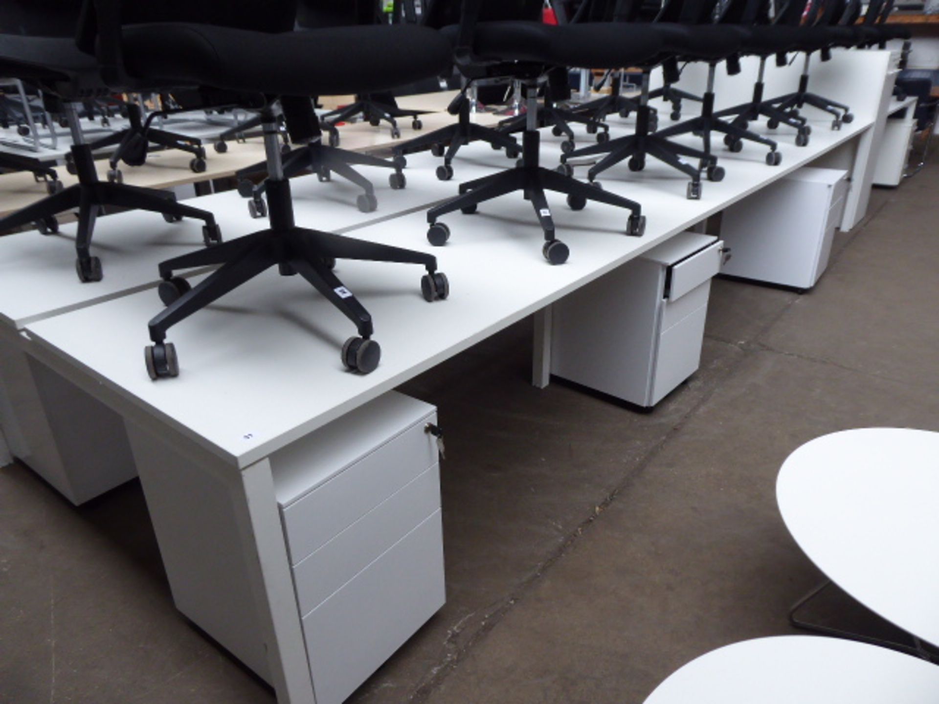 Bank of 6 Senator white 160cm workstations each with a mobile 3-drawer pedestals