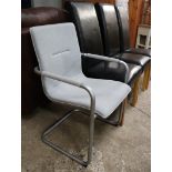 Grey upholstered and metal framed chair