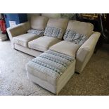 Beige upholstered 3 seater sofa with matching geometric patterned footstool