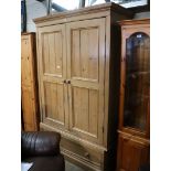 Reproduction stripped pine double door wardrobe with single drawer under