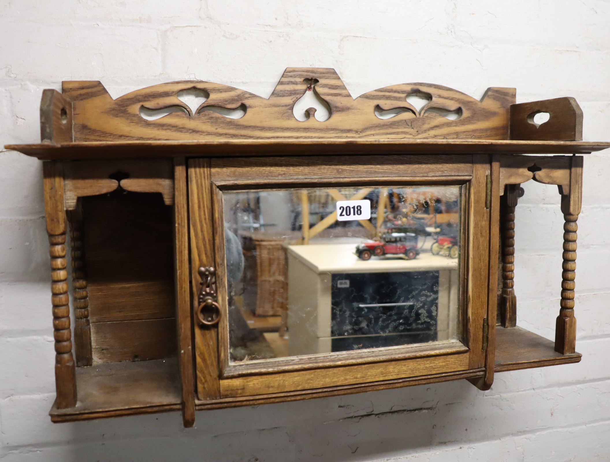 Small oak shelf with central mirrored door