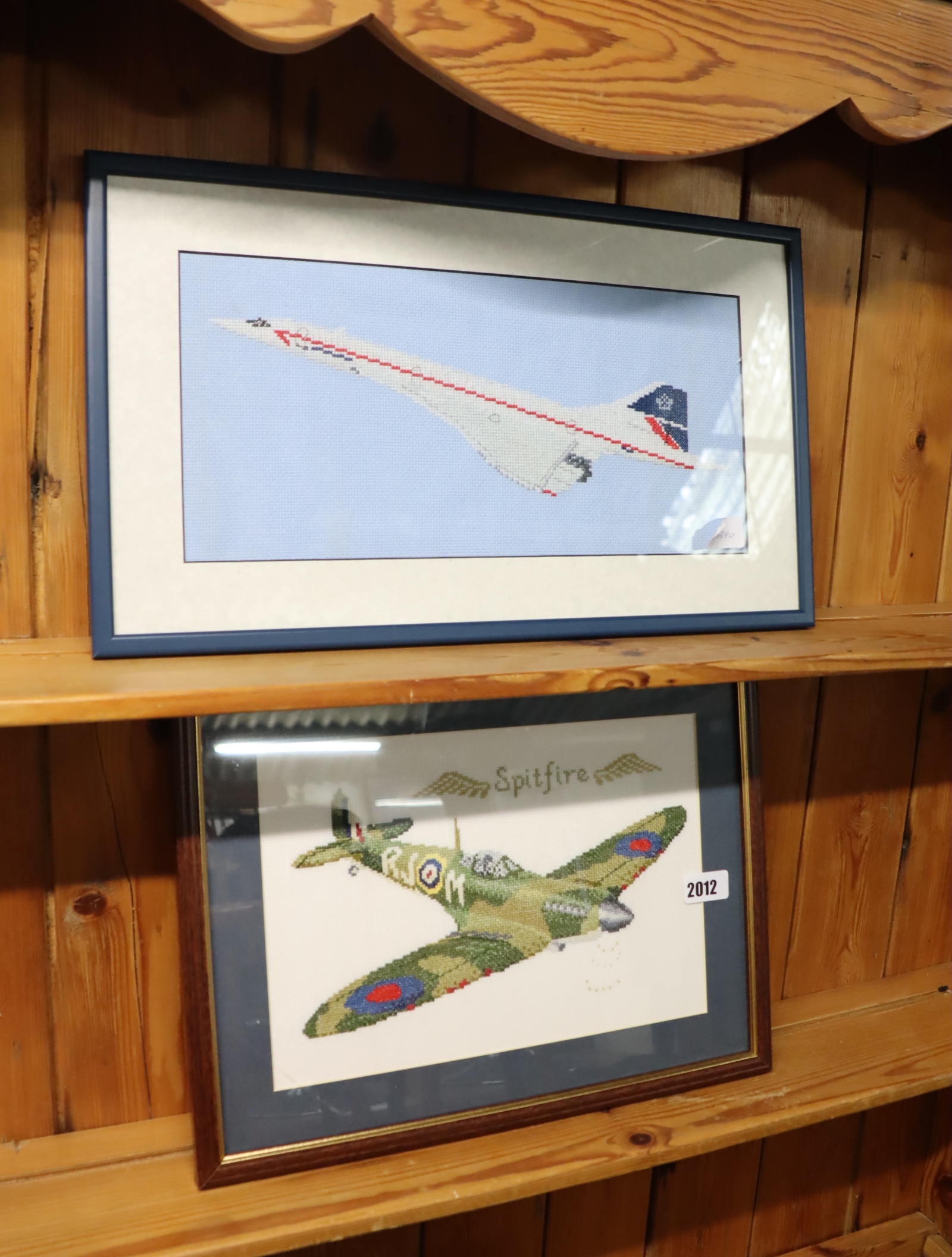 Pair of framed and glazed needlework pictures, aeroplanes