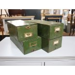 4 small green metal filing drawers