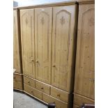 Pine effect triple door wardrobe with 5 drawers under