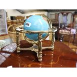 Ornamental globe on glass finish stand