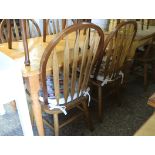 Rectangular kitchen table on turned supports with 4 stick back Windsor style chairs