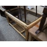 Cane and glass top coffee table with shelf under
