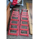 Pair of red metal car ramps
