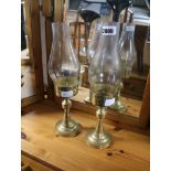 Pair of brass paddle holders with glass shades