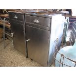 Pair of metal single door, single drawer laboratory cabinets on castors
