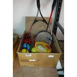 Box containing set of garden beach boules, tennis balls, shuttlecocks, 2 badminton rackets and