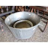 Large twin handled metal bath with smaller metal twin handled jam pan