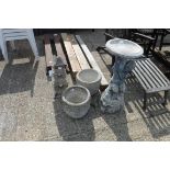 Concrete bird bath with pair of concrete garden plant pots and concrete Oriental pagoda