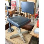 Black leather upholstered industrial stool on metal 4 star base