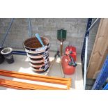 2 plastic jerry cans with pair of loppers, small digging spade and quantity of garden hose