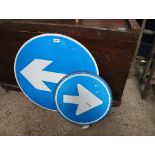 2 blue road signs; directional arrows