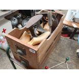 2 wooden desk drawers, the uppermost containing collection of cobblers lasts