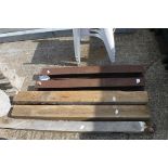 3 wooden posts with 2 metal RSJs