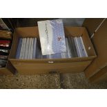 Box containing 25 packs of blue spotted curtains