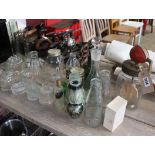 Glass blow butter churn No. 20 with various other glassware, bottles, decanters and moulds