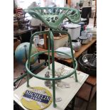 Green painted tractor seat stool