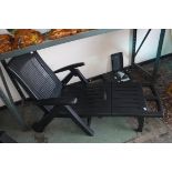 Black plastic garden collapsible sun lounger