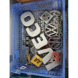 Shallow tray of vehicle badges incl. Iveco, VW Chevette, Vauxhall, etc.