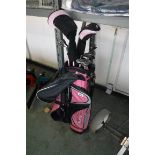 Ram golf bag in pink and black containing Ram girls golf clubs