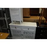 White 2 door cupboard with 2 drawers above and 3 drawer bedside table