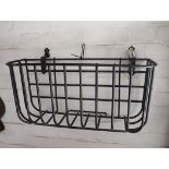 Black wrought metal wall hanging hay feeder