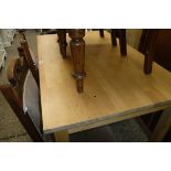 Beech dining table on castors