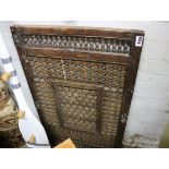 Reclaimed wooden door panel with decorative moulded lattice and spindle inserts