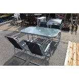 Square glass garden table with 6 matching black mesh garden chairs