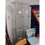 Sectional free standing cage type locker arrangement