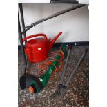 Black & Decker electric strimmer, red plastic watering can and pair of garden shears (fail)