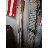 Pair of vintage oars with 1 further leather handled oar
