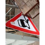 Road sign; Slippery when wet