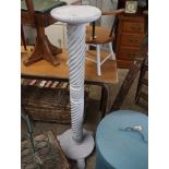 White painted column shaped plant stand