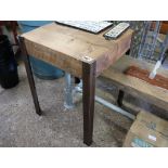 Wooden sleeper side table on angled metal supports