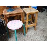 2 wooden laboratory stools and 1 pink painted stool on tubular support
