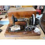 Frister & Rossmann German manually operated sewing machine in inlaid wooden case
