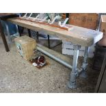 Wooden bench on tubular metal scaffold frame