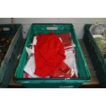 Crate containing ladies tops in red