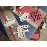 3 reproduction cast metal crown shaped coat hooks and 1 similar red coat hook