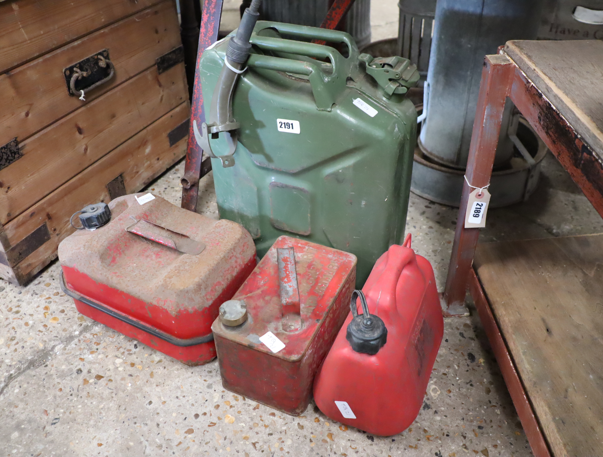 20L green metal jerry can with small red petroleum spirit can and 2 further petrol cans